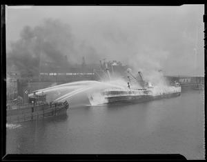 Fireboat hosing down the Danish freighter "Laila" (possibly Mystic Pier 45, Charlestown)