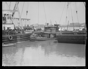 Pulling up sunken tug "Eileen Ross" at T-Wharf