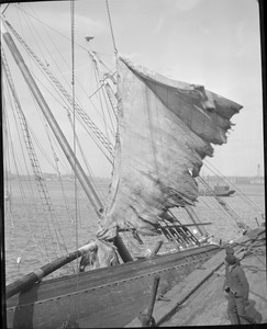 Sailing vessel capsizes at wharf