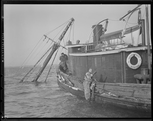 Tug "Betsy Ross" attending to sunken ship "O'Hara"