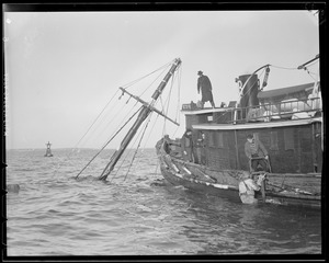 Tug "Betsy Ross" attending to sunken ship "O'Hara"