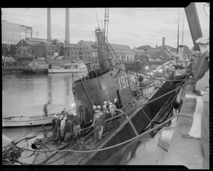 Squalus crew and salvage workers pumping out last of the water in Portsmouth Navy Yard after the sub was rinsed