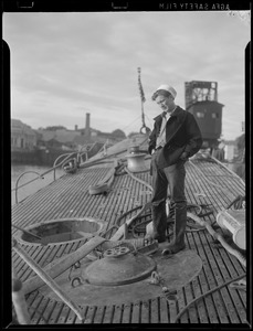 Navy workman stands on deck of sub "Squalus" at Portsmouth Navy Yard