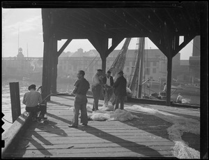Boston T wharf area - fishermen mending net (actually Eastern Packet Pier)
