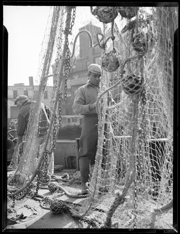 Fisherman repairing nets - Digital Commonwealth