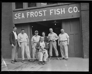 Employees in front of Sea Frost Fish Co.