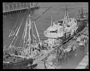 Ice covered trawler Red Jacket at fish pier