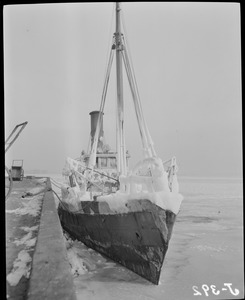 Fishing boats covered with ice in Boston Harbor