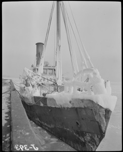 Fishing boats covered with ice in Boston Harbor