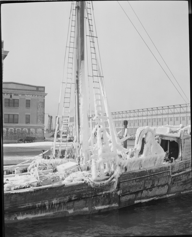 Fishing boats covered with ice in Boston Harbor