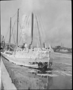 Fishing boats covered with ice in Boston Harbor