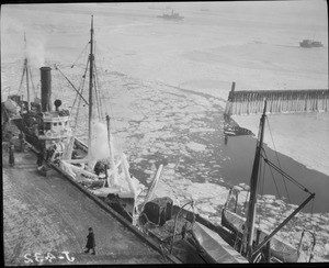 Fishing boats covered with ice in Boston Harbor