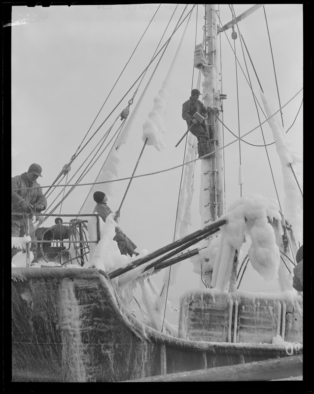 Ice covered fishing trawler "Swallow" at fish pier