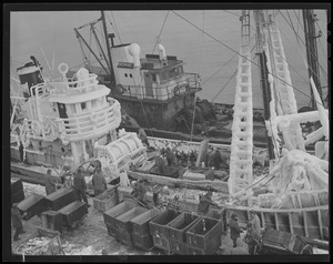 Ice covered fishing trawler "Cambridge" at fish pier