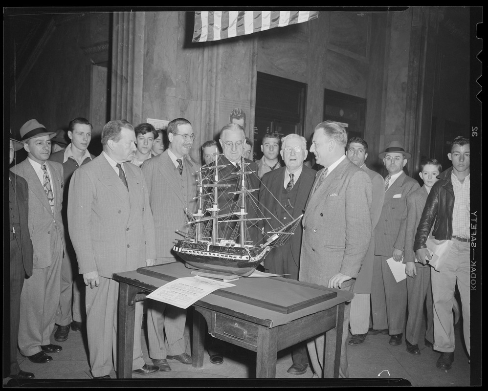 Crowd with commemorative model of the USS Constitution