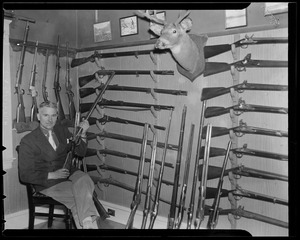 Man with rifle collection