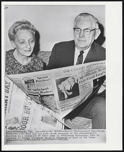 Checking Print--United Steelworkers Secretary-Treasurer I.W. Abel and his wife check coverage of the steelworker's election in a newspaper at their home in Pittsburgh Wednesday. Abel is seeking to defeat incumbent David J. McDonald as head of the labor organization.