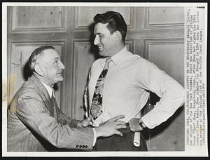 Yankee Skipper on the Beam-Casey Stengel (left), new skipper of the New York Yankees, feels the waistline of pitcher Frank "Spec" Shea, Naugatuck, Conn., after Shea had signed his 1949 contract here today. Shea pitched for Stengel in 1946 when the latter was manager of the Oakland club of the Pacific Coast League.
