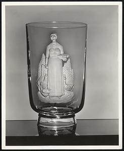 A glass vase with an original design by Grant Wood included in an exhibition of decoration in glass by twenty-seven world famous artists commissioned by Steuben Glass, Inc., entitled "Twenty-seven Artists in Crystal".