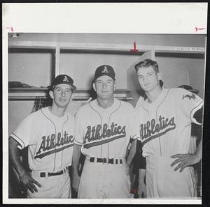 Former New York Yankees Billy Martin (left) and pitcher Ralph Terry (right) pose with Kansas City Athletics’ coach Harry Craft. Scrappy infielder Martin, Terry and two New York farmhands were swapped to A’s, Saturday, for outfielder Harry Simpson, pitcher Ryne Duren and outfielder Jim Pisoni.