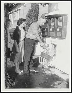 Mr. & Mrs. Herbert Chickering of Dedham buy ice in W. Rox.