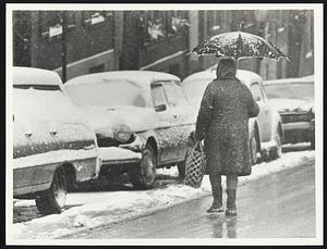 Storm Pic. Elderly women w/ umbrella on Mt Vernon St.