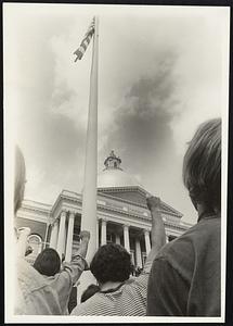 State House Lawn as flag goes down fist's raised.