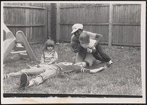 Children playing in a backyard