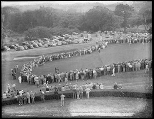 Spectators ring green during tournament at the Belmont Country Club