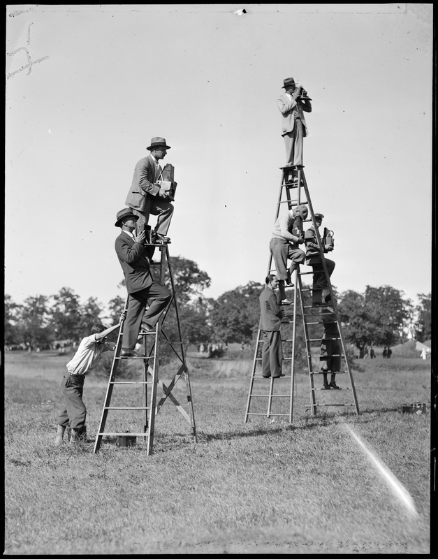 Cameramen mount ladders at tournament in Rhode Island