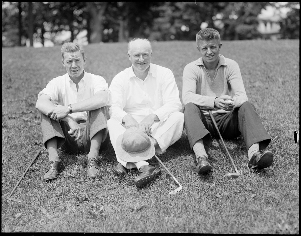 Three golfers take a rest