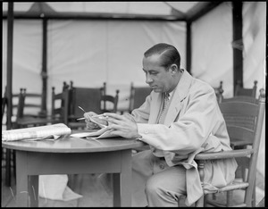 Walter Hagen writing up the amateur rounds for the press, at Brae Burn
