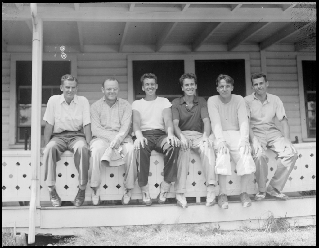 Six golfers on porch