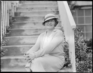 Mrs. Baker poses on steps