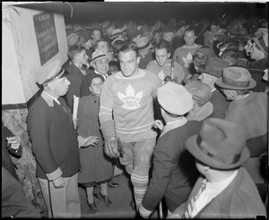 Toronto Maple Leafs including C. Conacher pushing through crowd at Garden