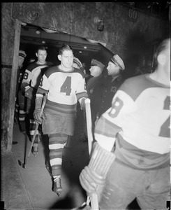 Bruins, including Shields, no. 4, and Dit Clapper, head onto the ice at Boston Garden.