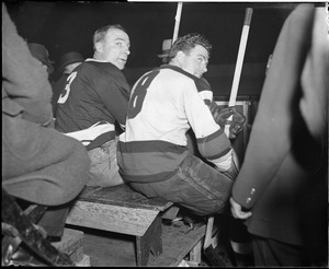 Hockey stars Lionel Conacher, left, and Roger Jenkins of the Bruins, on bench for being rough on the ice.