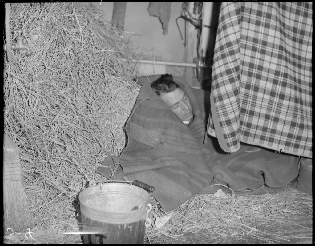 Man takes a nap, behind the curtain at the Boston Horse Show at the Boston Garden