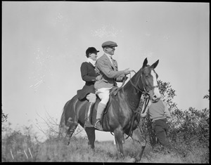 Man and woman on horseback