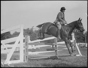 Elizabeth Clark riding George H.D. Lamson's Bay Boy, winner of class 2 pony jumping at Southborough horse show, Wolf Pen Farm Cup