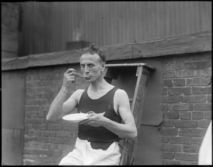 Clarence DeMar eating soup after marathon victory?