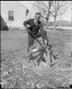 Clarence DeMar saving wood.
