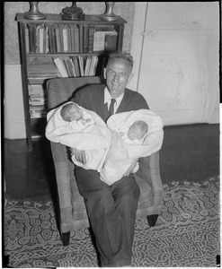 Clarence DeMar with two babies.