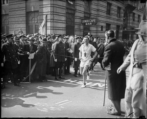 No. 9 crossing finish line at B.A.A. marathon