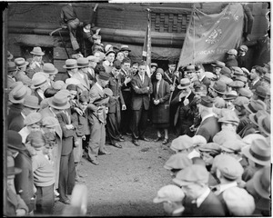 Crowd surrounds Clarence DeMar and wife after he won his seventh marathon, a 26 mile grind from Hopkinton to Boston.