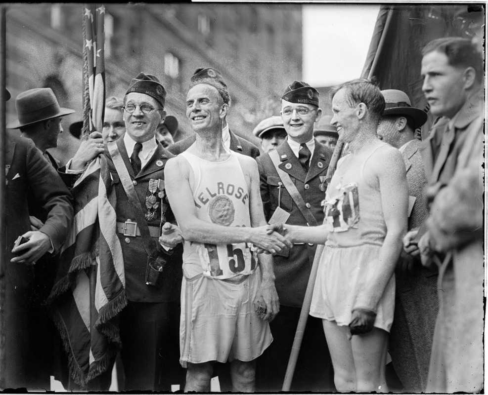 Willie Kyronen of Finnish-American A.C. New York, wins second in marathon time 2 hours 36 minutes 27 seconds 4/5. He is at the right, Clarence DeMar left