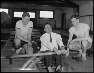 Crew coach Charlie Whiteside plies an oar while two Harvard champs, Gridley Barrows, wrestling, left and Bradford Simmons, boxing, look on.