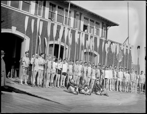 M.I.T. crew on float at boat house
