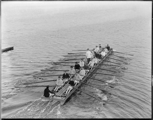 Harvard's crew row scow on Charles