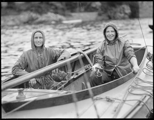 Two girls sailing on a rainy day